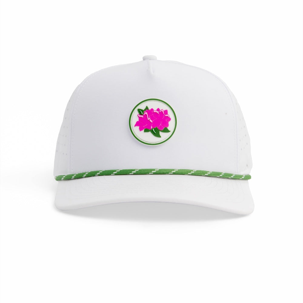 Azalea Field, straight-on view of the white performance hat with a round patch of pink azalea blooms in a green border and a green-and-white braided rope across the crown